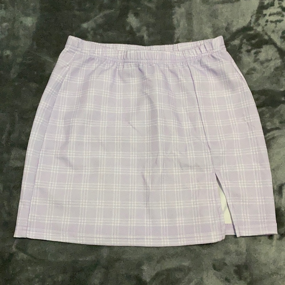Mini skirt size Small. Slit on the left thigh
